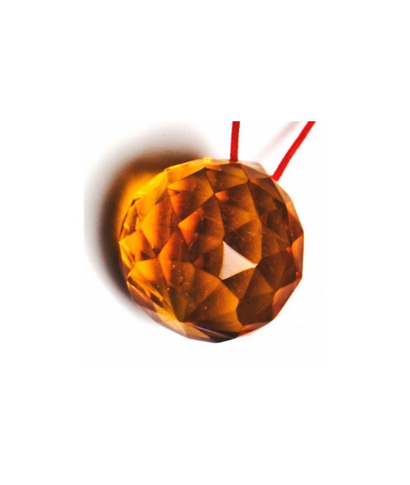 Bola facetada de cristal AMBAR de 30 mm. de diametro.
Engarzada en cordón natural.