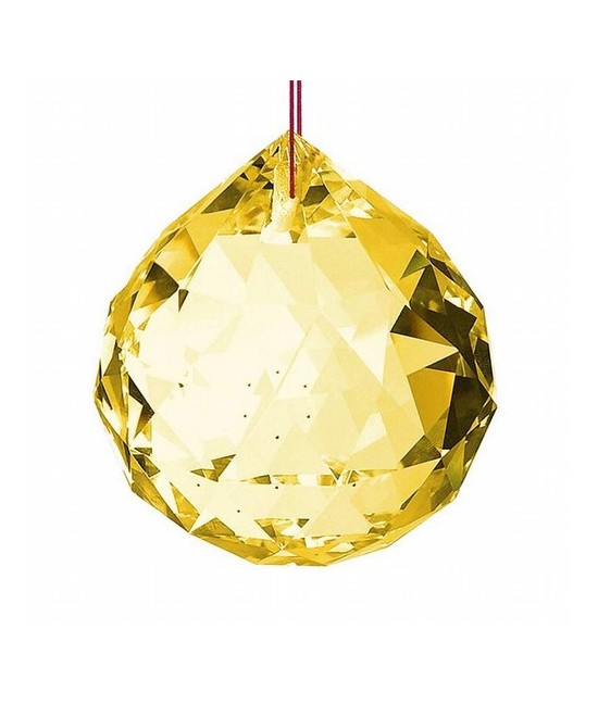 Bola facetada de cristal AMBAR de 50 mm. de diametro.
Engarzada en hilo rojo.

En el feng Shui, las bolas de cristal se util
