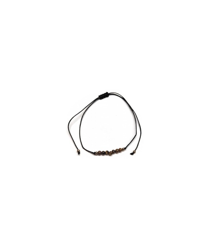 Pulsera de bolas de Ojo de Tigre de 4mm en hilo negro ajustable.

Tarjeta exclusiva en 3 idiomas.