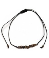 Pulsera de bolas de Ojo de Tigre de 4mm en hilo negro ajustable.

Tarjeta exclusiva en 3 idiomas.
