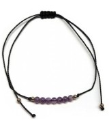 Pulsera de bolas de Amatista de 4mm en hilo negro ajustable.

Tarjeta exclusiva en 3 idiomas.