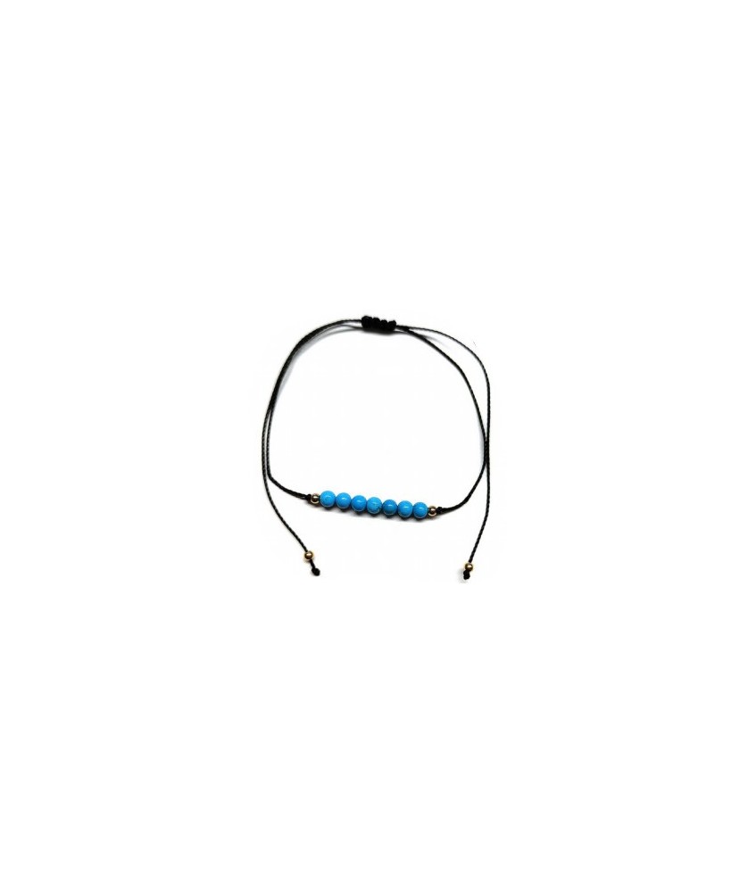 Pulsera de bolas de Turquenita de 4mm en hilo negro ajustable.

Tarjeta exclusiva en 3 idiomas.