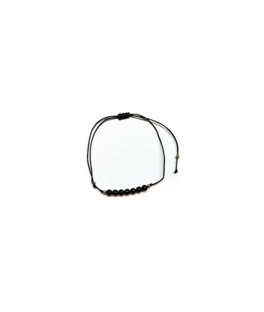 Pulsera de bolas de Onix de 4mm en hilo negro ajustable.

Tarjeta exclusiva en 3 idiomas.