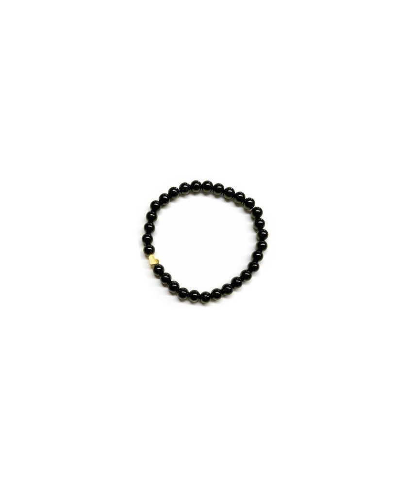 Pulsera de Ónix( bolas de 6mm) con símbolo de corazón dorado.

En goma elástica.

Tarjeta exclusiva en 3 idiomas.