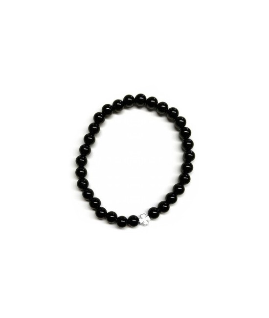 Pulsera de Ónix( bolas de 6mm) con símbolo de trébol plateado.

En goma elástica.

Tarjeta exclusiva en 3 idiomas.