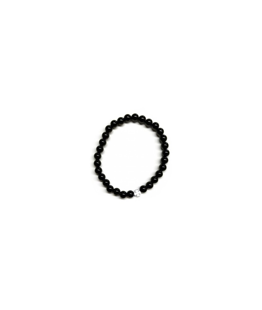Pulsera de Ónix( bolas de 6mm) con símbolo de trébol plateado.

En goma elástica.

Tarjeta exclusiva en 3 idiomas.