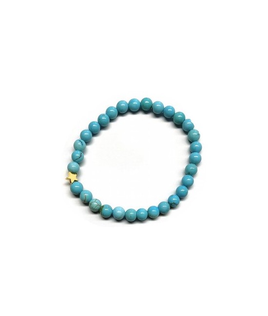 Pulsera de Turquenita (bolas de 6mm) con símbolo de estrella dorada.

En goma elástica.

Tarjeta exclusiva en 3 idiomas