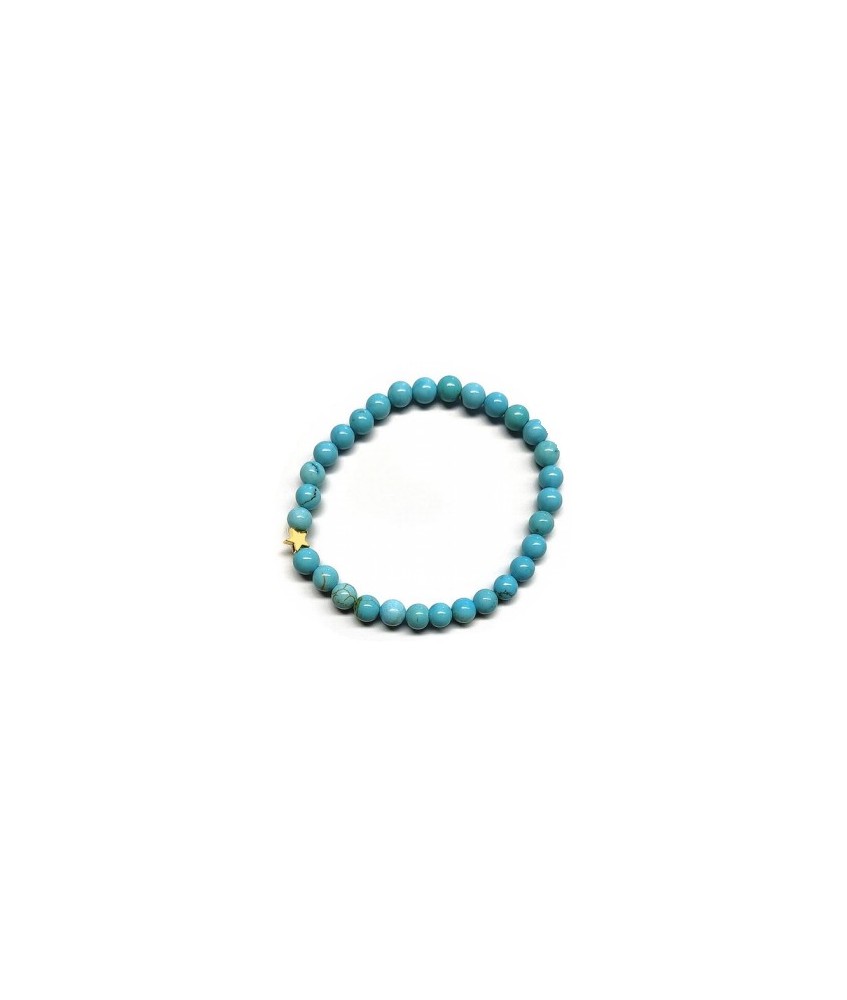 Pulsera de Turquenita (bolas de 6mm) con símbolo de estrella dorada.

En goma elástica.

Tarjeta exclusiva en 3 idiomas