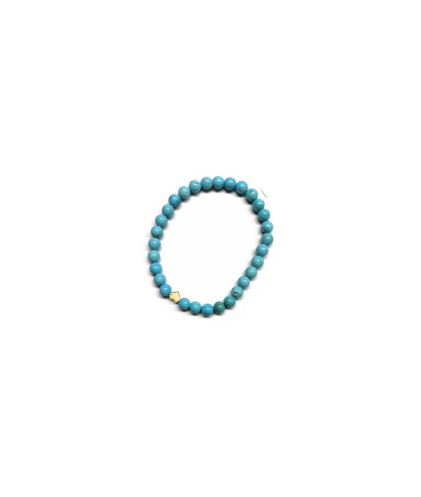 Pulsera de Turquenita (bolas de 6mm) con símbolo de corazón dorado.

En goma elástica.

Tarjeta exclusiva en 3 idiomas.