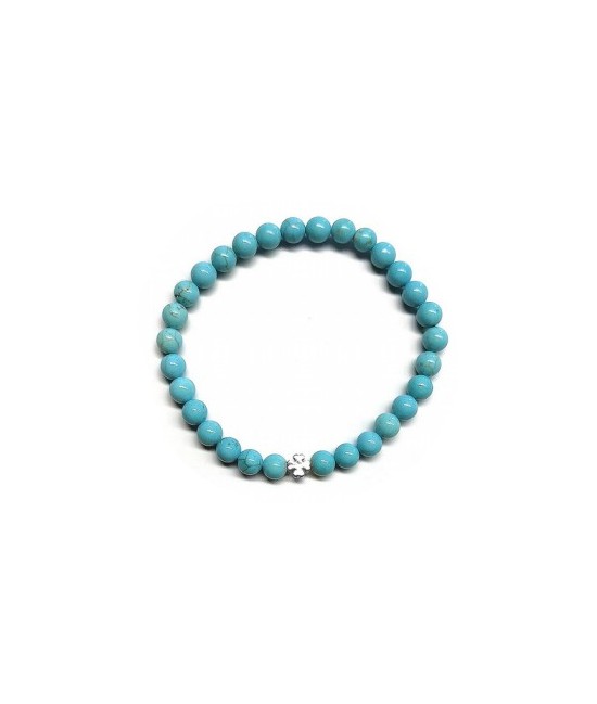 Pulsera de Turquenita (bolas de 6mm) con símbolo de trébol plateado.

En goma elástica.

Tarjeta exclusiva en 3 idiomas