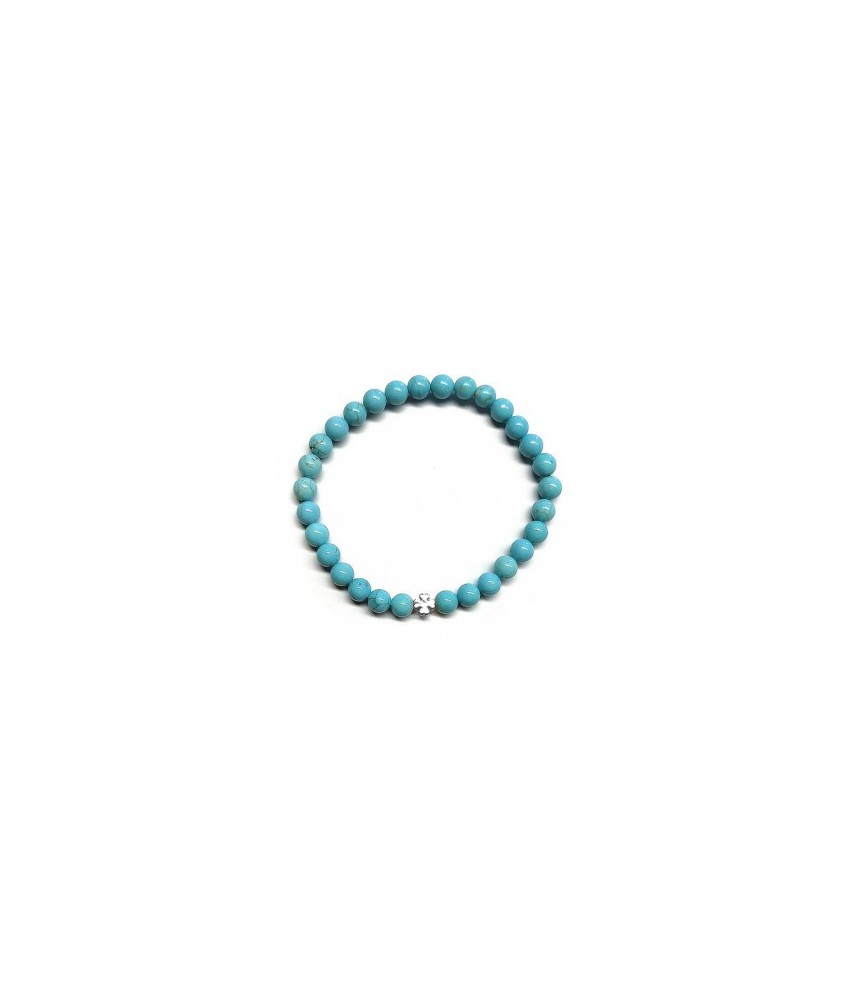 Pulsera de Turquenita (bolas de 6mm) con símbolo de trébol plateado.

En goma elástica.

Tarjeta exclusiva en 3 idiomas