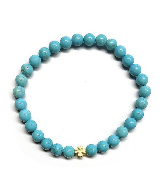 Pulsera de Turquenita (bolas de 6mm) con símbolo de trébol dorado.

En goma elástica.

Tarjeta exclusiva en 3 idiomas.