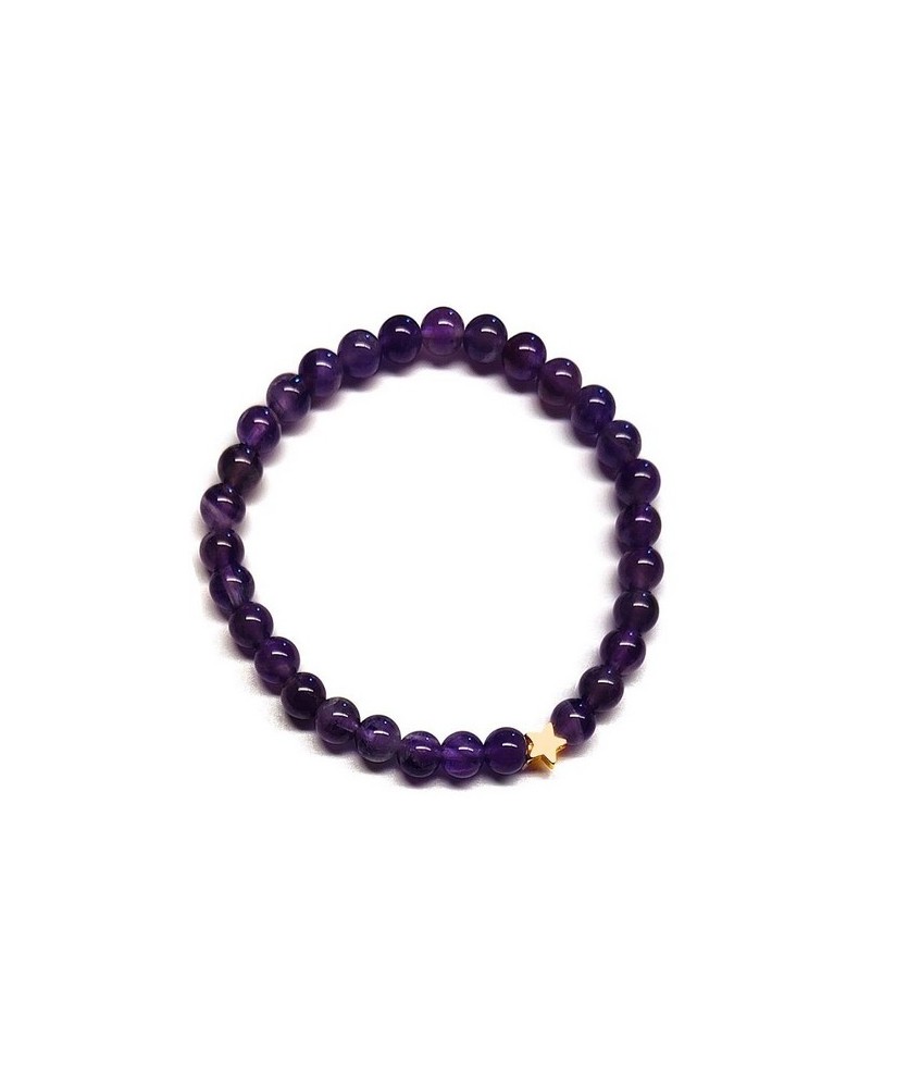 Pulsera de Amatista (bolas de 6mm) con símbolo de estrella dorada.

En goma elástica.

Tarjeta exclusiva en 3 idiomas.