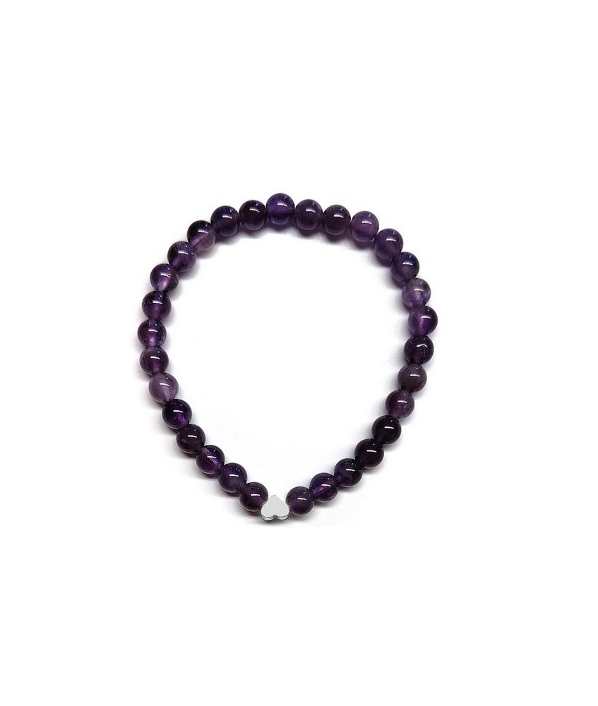 Pulsera de Amatista (bolas de 6mm) con símbolo de corazón plateado.

En goma elástica.

Tarjeta exclusiva en 3 idiomas.