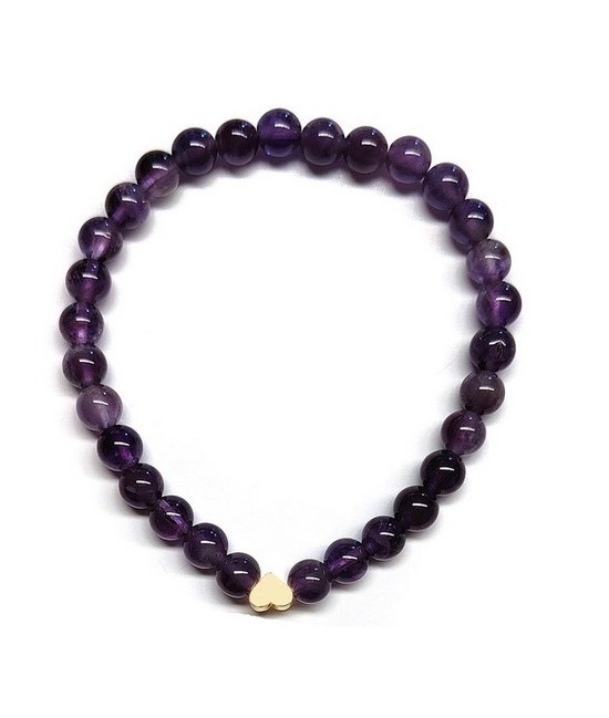 Pulsera de Amatista (bolas de 6mm) con símbolo de corazón dorado.

En goma elástica.

Tarjeta exclusiva en 3 idiomas