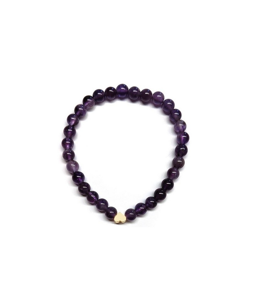 Pulsera de Amatista (bolas de 6mm) con símbolo de corazón dorado.

En goma elástica.

Tarjeta exclusiva en 3 idiomas