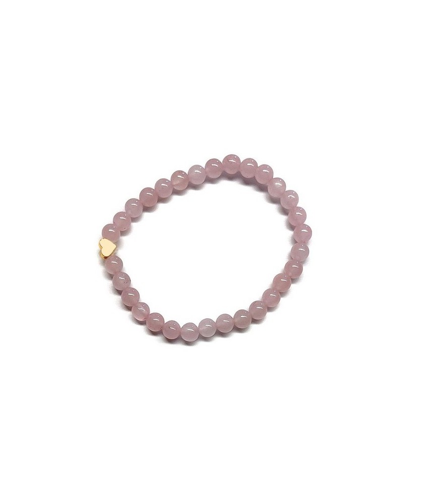 Pulsera de Cuarzo Rosa (bolas de 6mm) con símbolo de corazón dorado.

En goma elástica.

Tarjeta exclusiva en 3 idiomas.