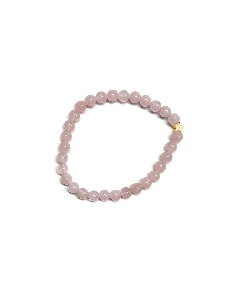Pulsera de Cuarzo Rosa (bolas de 6mm) con símbolo de estrella dorada.

En goma elástica.

Tarjeta exclusiva en 3 idiomas.