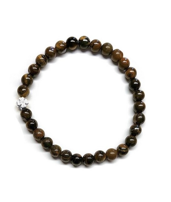 Pulsera de Ojo de Tigre (bolas de 6mm) con símbolo de trébol plateado.

En goma elástica.

Tarjeta exclusiva en 3 idiomas.