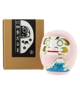 Para los japoneses, tanto daruma como el monte Fuji son símbolos espirituales, budista uno y sintoísta el otro. En esta figurit